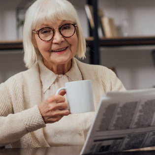  Elderly woman drinking a coffee
