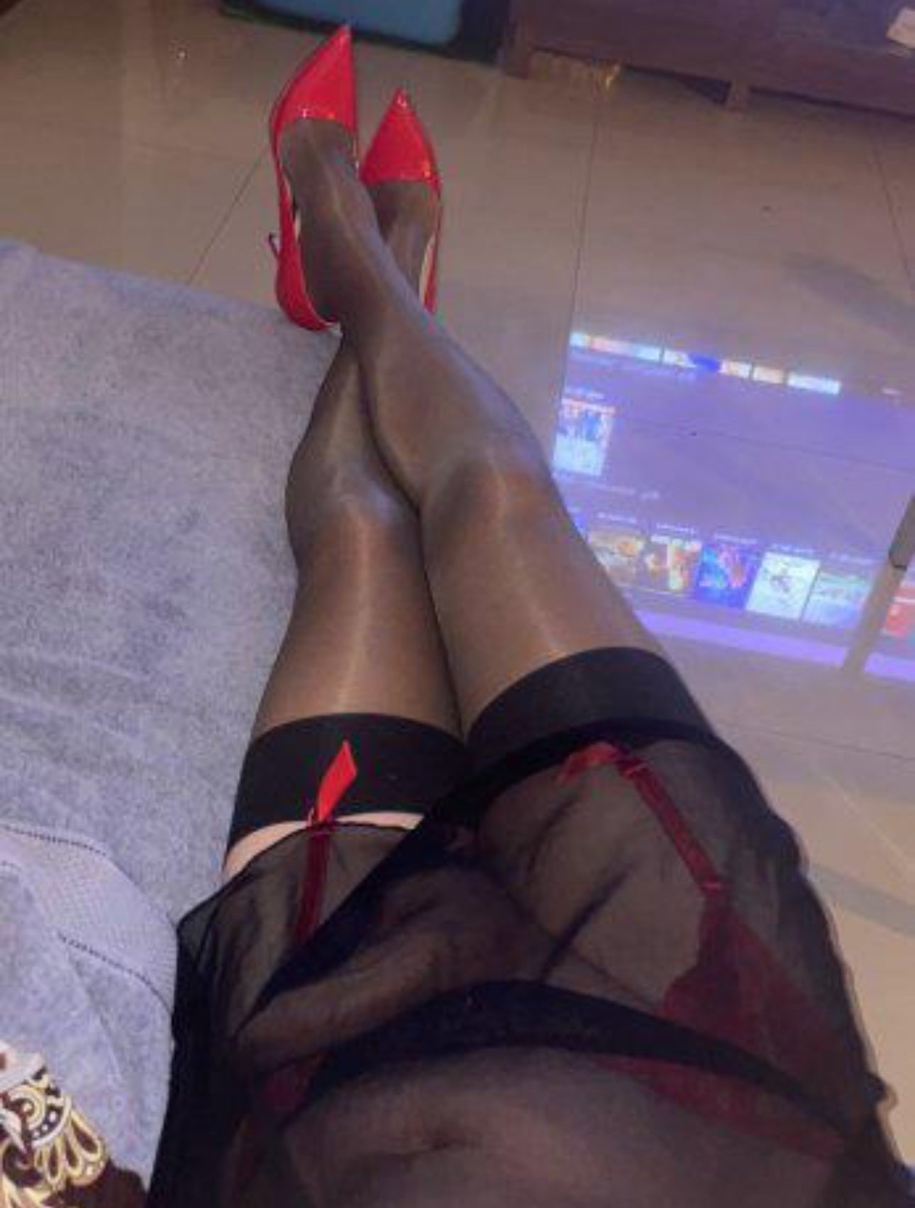 Cross dresser wearing stockings and suspenders